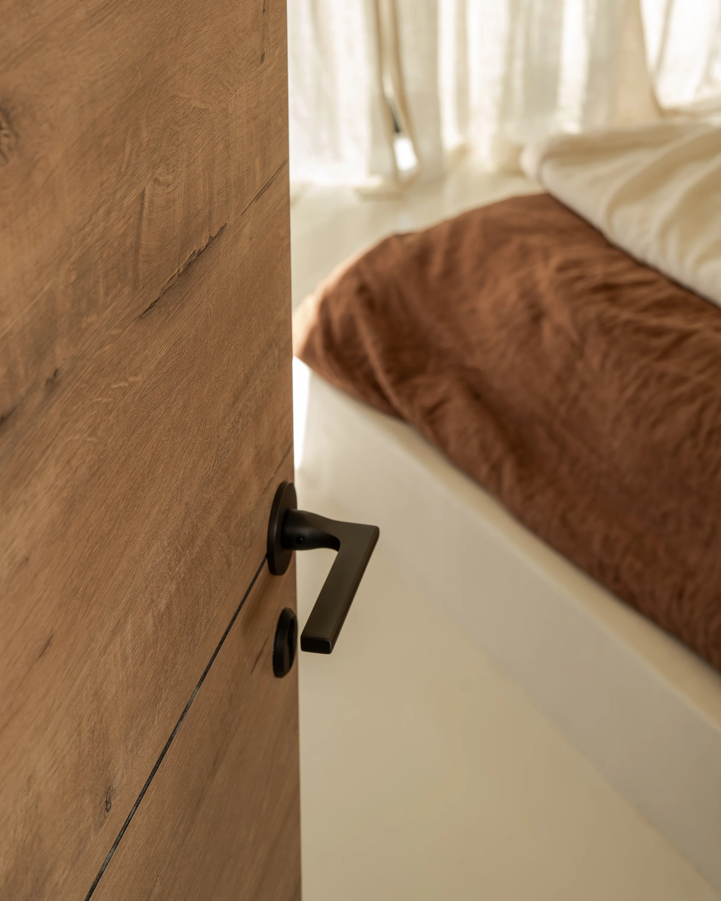 Clayton Sprung Door Handle With Flush Rose - Bronze - Image 4